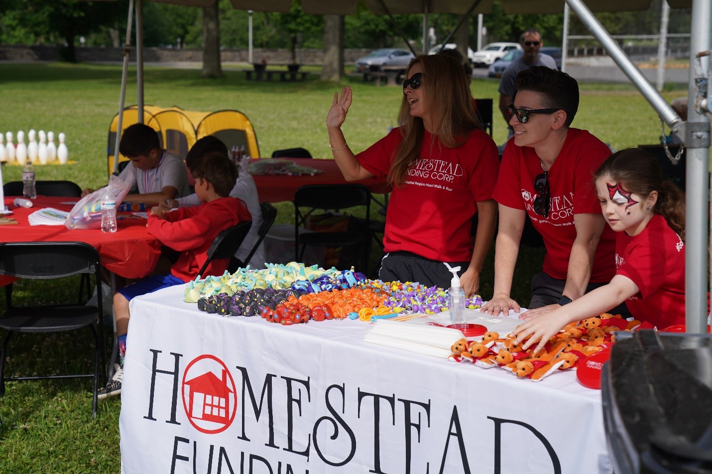 Homestead Funding employees volunteering in the kids' tent at the 2022 Capital Region Heart Walk & Run.