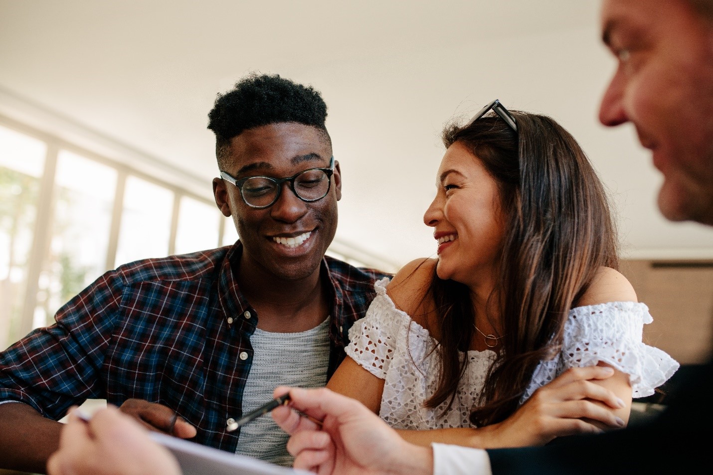 A couple with their Real Estate Agent.