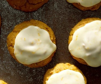 Pumpkin Spice Cookies by Jessica Beckstead topped with an orange frosting.